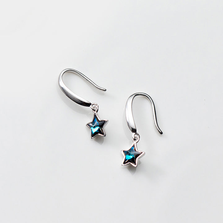 Boucle d'oreille pendante étoile argent 925, cristal bleu - Femme. Éclat céleste avec une étoile resplendissante en cristal bleu.