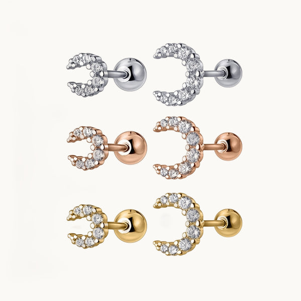 Ce sont des boucles d'oreilles en forme de lunes ornées de strass. Elles sont en 2 tailles différentes et en trois couleurs différentes : Or, Or rose, Argent. 