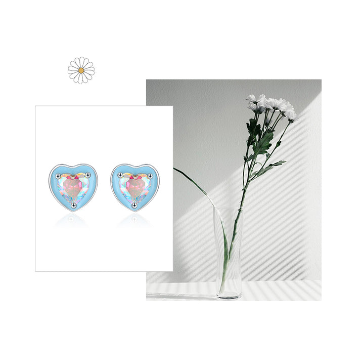 Boucle d'oreille coeur bleu diamant bleu rose en argent 925 - Femme. Un cœur bleu avec un diamant de zirconium au centre, rappelant les couleurs d'un ciel au crépuscule.