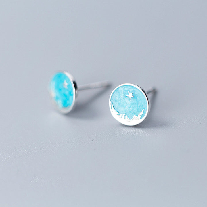 Boucle d'oreille ronde bleu ciel étoile en argent 925, ajoutant une touche d'éclat à toute tenue féminine.
