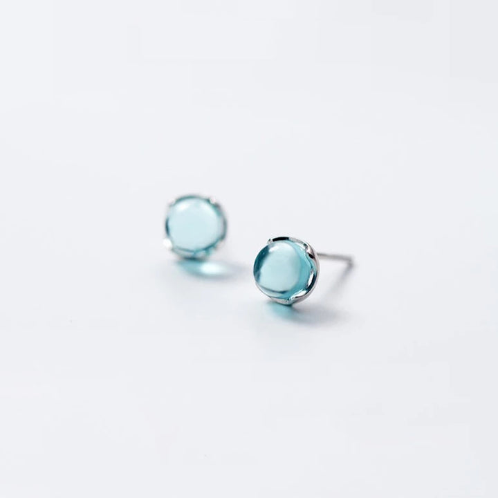 Boucle d'oreille ronde avec cristal bleu clair, argent 925 - Bijou élégant pour femme, parfait pour une tenue quotidienne ou une soirée.