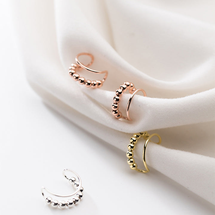 Boucle d'oreille cartilage sans trou double anneau perle métallique - Femme - Argent 925. Élégantes boucles d'oreille en argent et or avec perles métalliques raffinées. Luxe discret sans perçage.