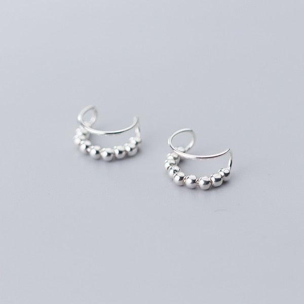 Boucle d'oreille cartilage sans trou, double anneau perle métallique en argent 925 - Femme. Élégance et innovation réunies dans ces bijoux raffinés.