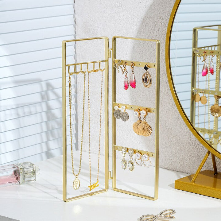 Présentoir rotatif doré pour boucles d'oreille et colliers, solution de rangement élégante et fonctionnelle pour les amateurs de bijoux sophistiqués.