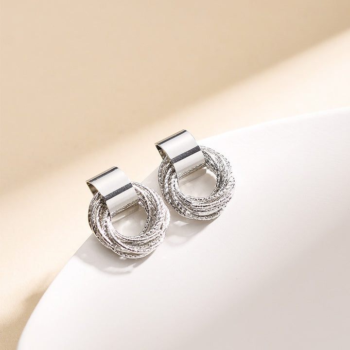 Boucle d'oreille ronde multi anneaux torsadés - Femme, en argent, design élégant et sophistiqué, apporte une touche raffinée à votre tenue.