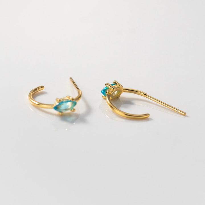 Boucle d'oreille anneau diamant marquise amande bleu ciel - Femme - Argent 925. Bijou raffiné en argent avec un diamant bleu ciel éblouissant. Must-have pour chaque collection.